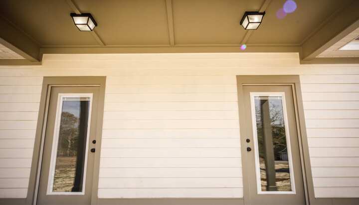 We offer siding services in Philadelphia, Pennsylvania. Hardie plank siding installation in a front entry way.